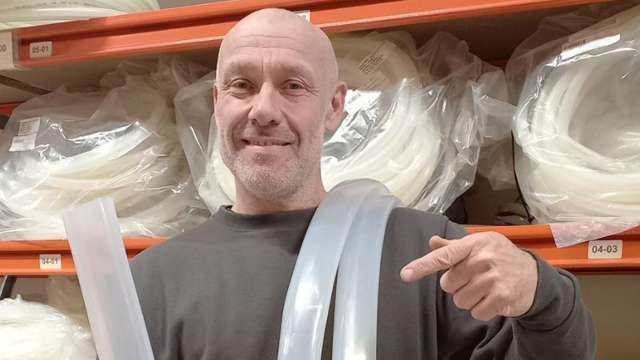 Man holding a silicone hose
