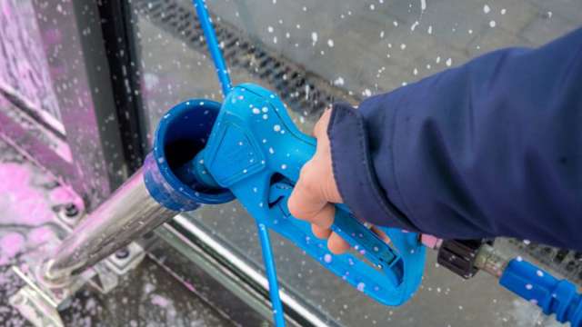 Hand holding spray gun