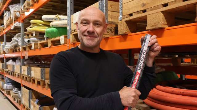 Man holding a stock industrial hose