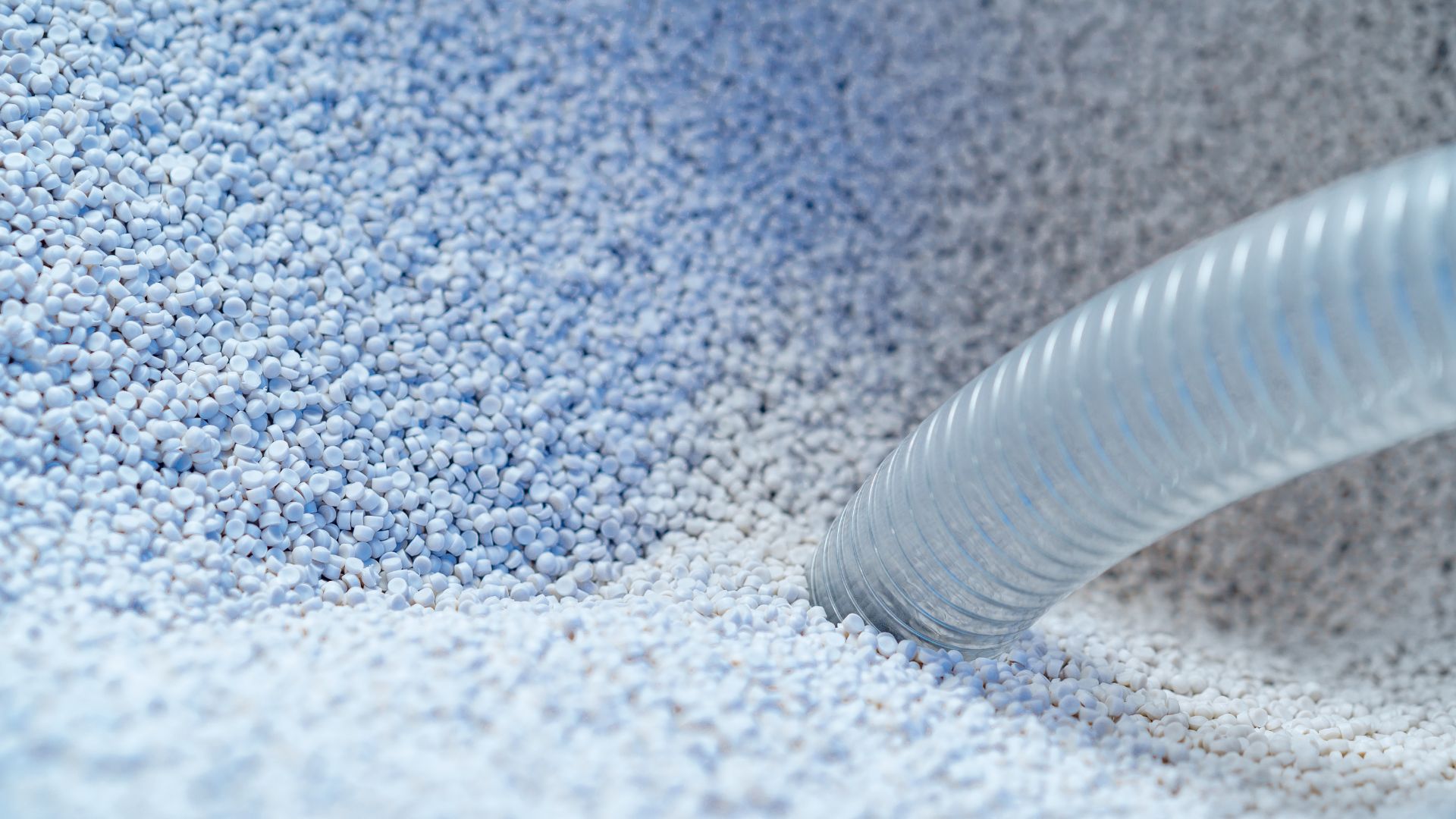 granules being sucked up into a vacuum hose