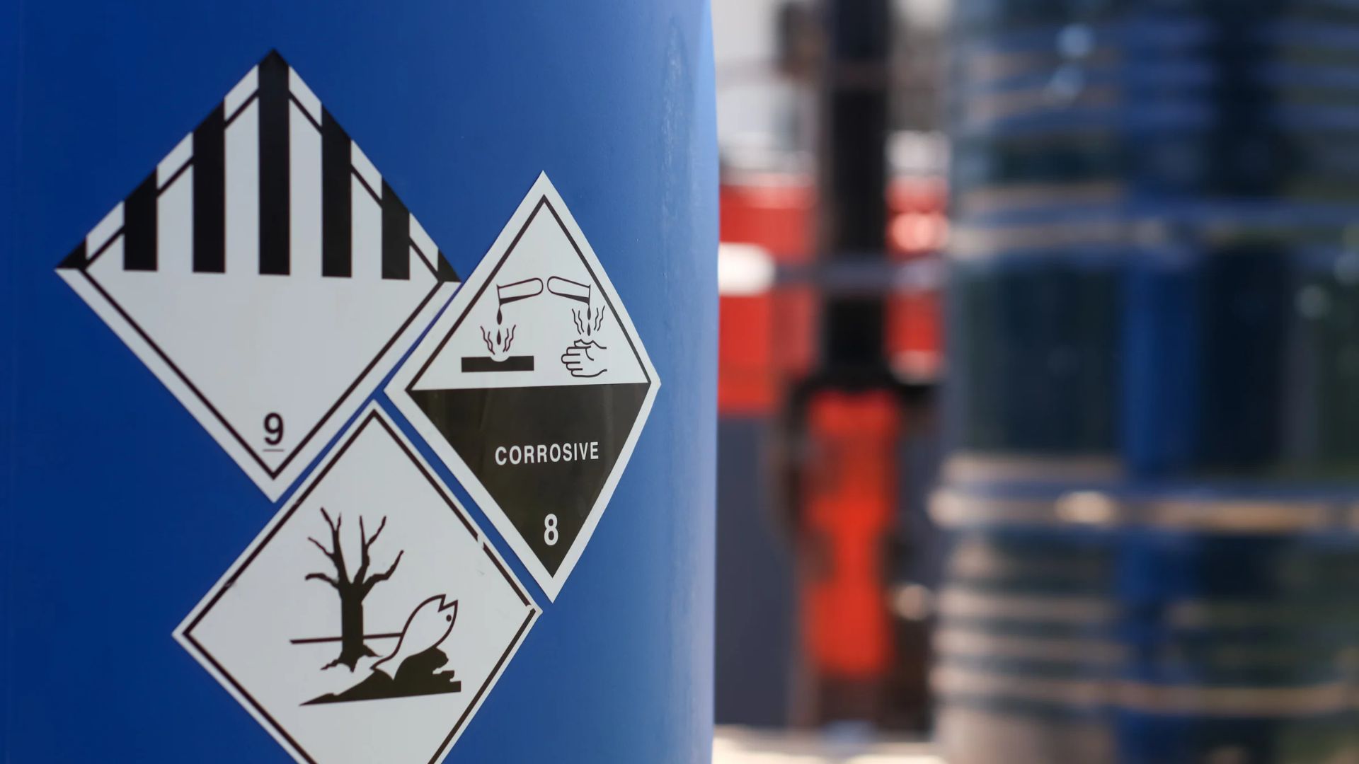 corrosive chemical symbol on a tank